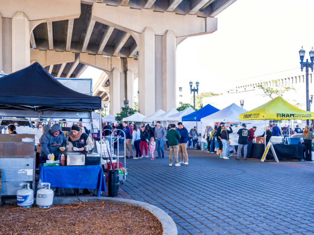 View of the crowd wandering around the booths at the Riverside Arts Market