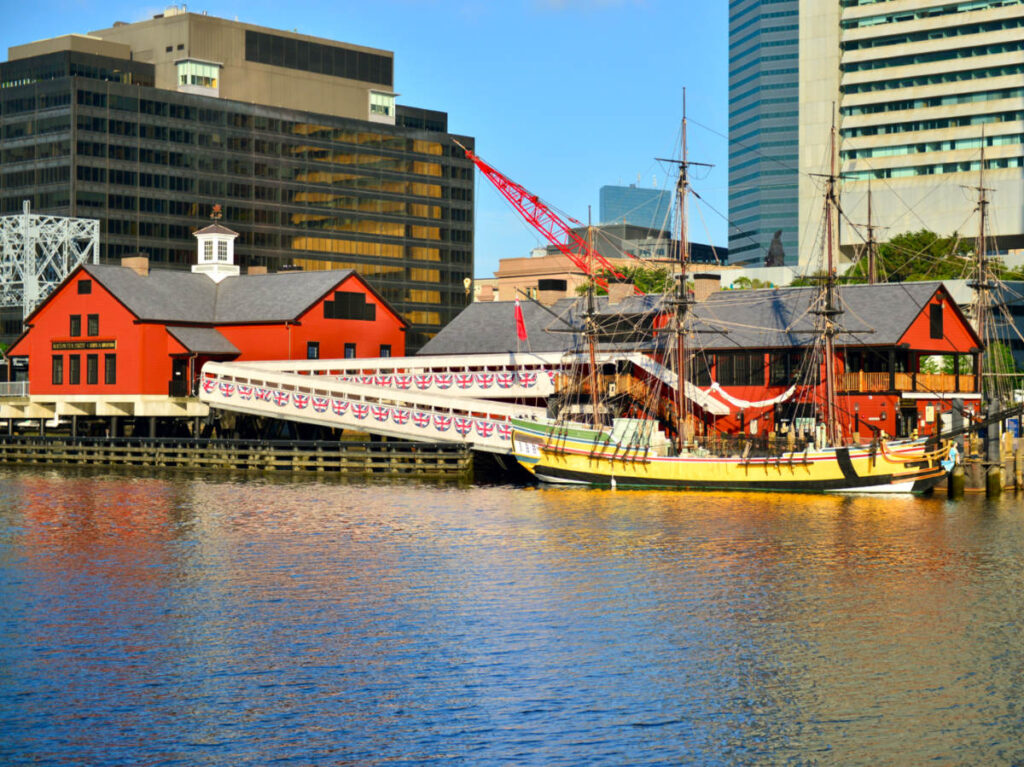 Boston Tea Party Ships & Museum with a large building in the background