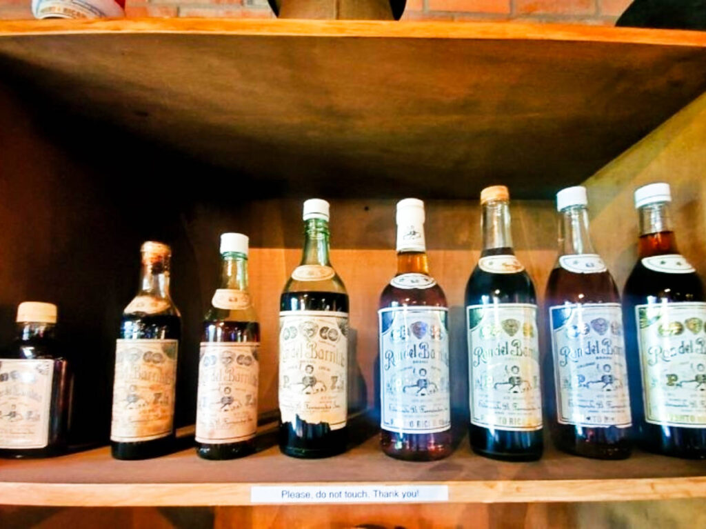Different bottles of rum lined on a shelf