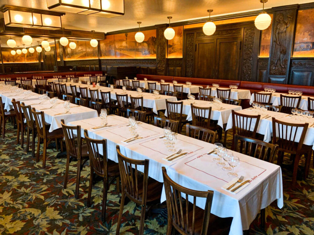 View of the interior and empty tables at Bouillon République
