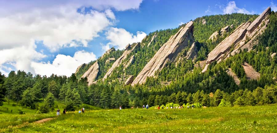 View of people from afar wandering on Flatiron in Boulder