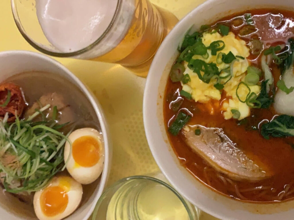 Bowl of ramen and glasses of beer