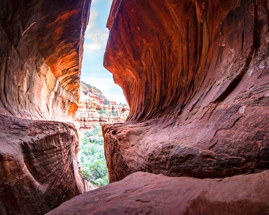 Scenic view of the red rocks from the inside of a secret unique cave in Sedona