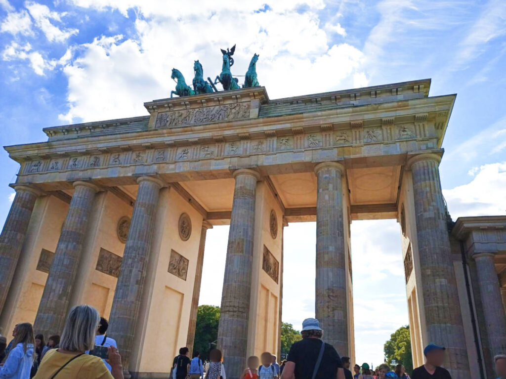 People crossing the Brandenburg Gate in Berlin