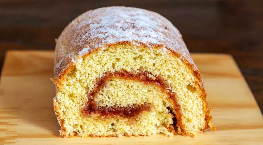 A Brazo Gitano topped with powdered sugar