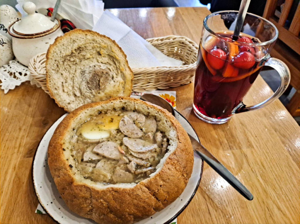 Closeup look of the bread bowl and a glass of fruit punch