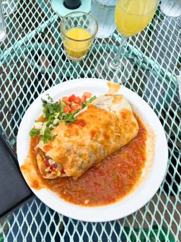 A plate of smothered breakfast burrito at Blackbird Cafe
