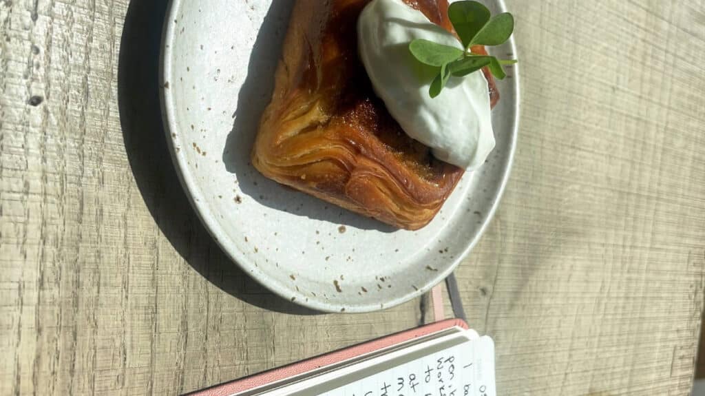 View of the author, Sky Ariella's breakfast and journal on a table