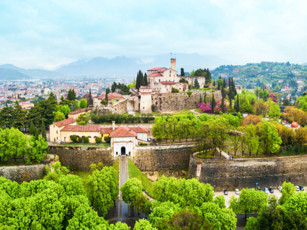 Aerial view of the Brescia Castle surrounded by greenery