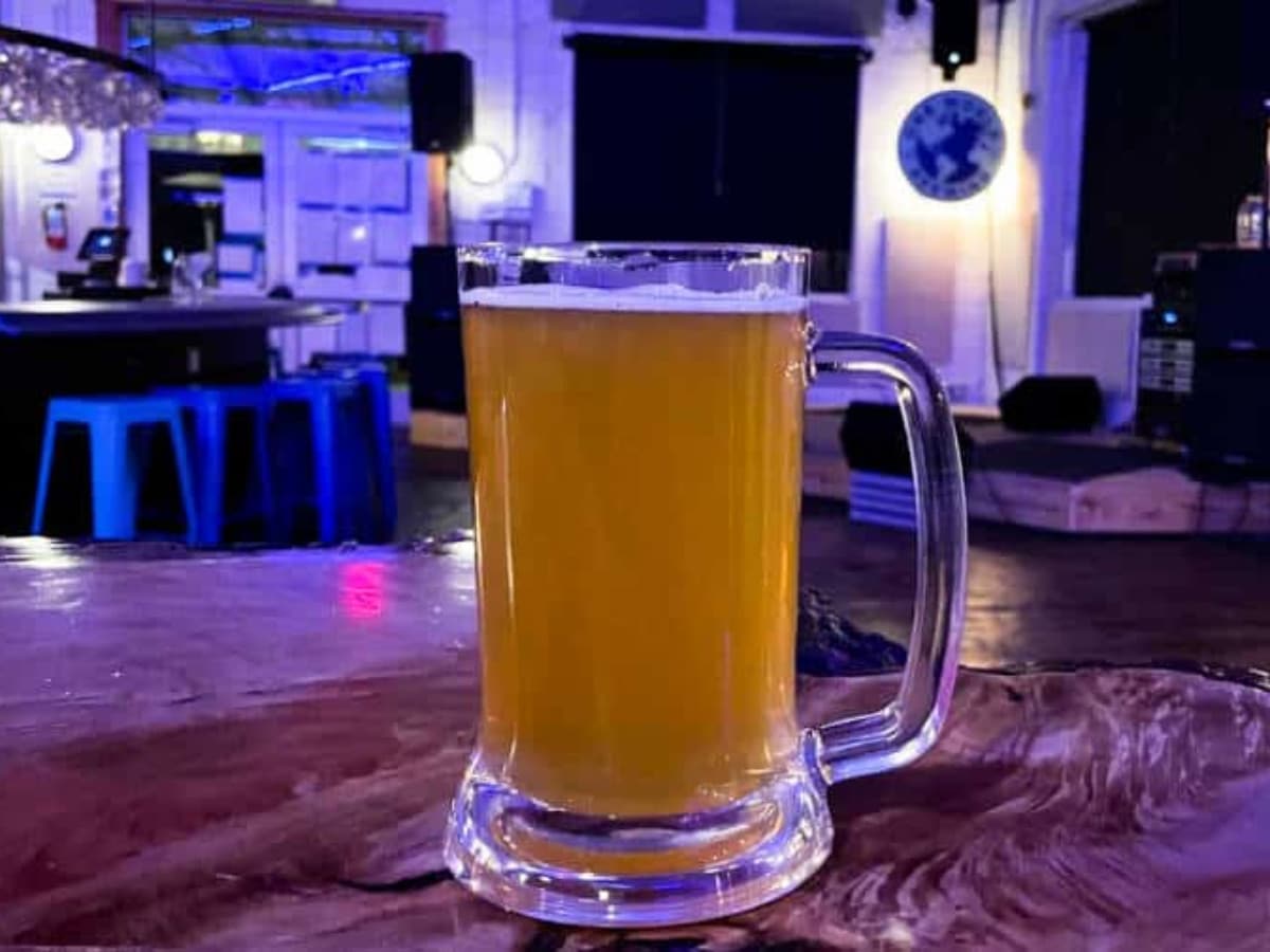 A glass of beer served at One World Brewing in West Asheville