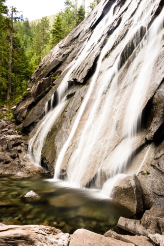 The satin-like water of Bridal Veil Falls runs down the rocky mountain of Washington