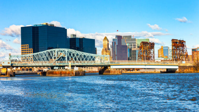View of the bridge and the skyline of the city of Newark from across the water