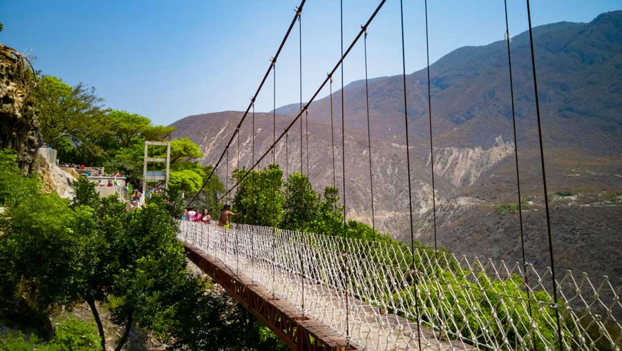 People crossing the suspension bridge in Las Grutas de Tolantongo