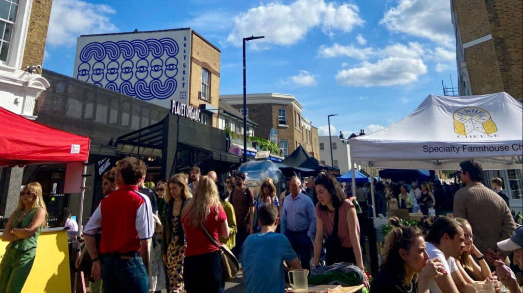People during a sunny morning in Broadway Market