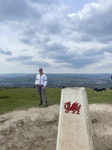 The author Brooke Horrobin standing at the top of Garth Hill
