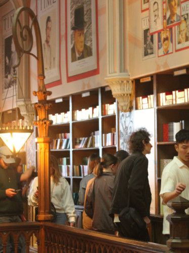 People browsing books at Livraria Lello