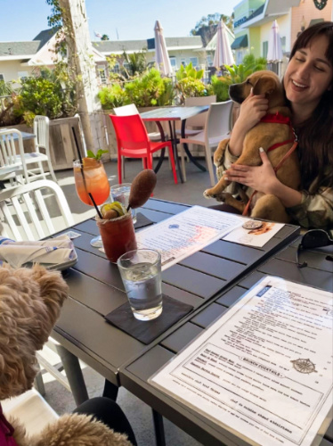 The author's friend with dogs at the Compass restaurant