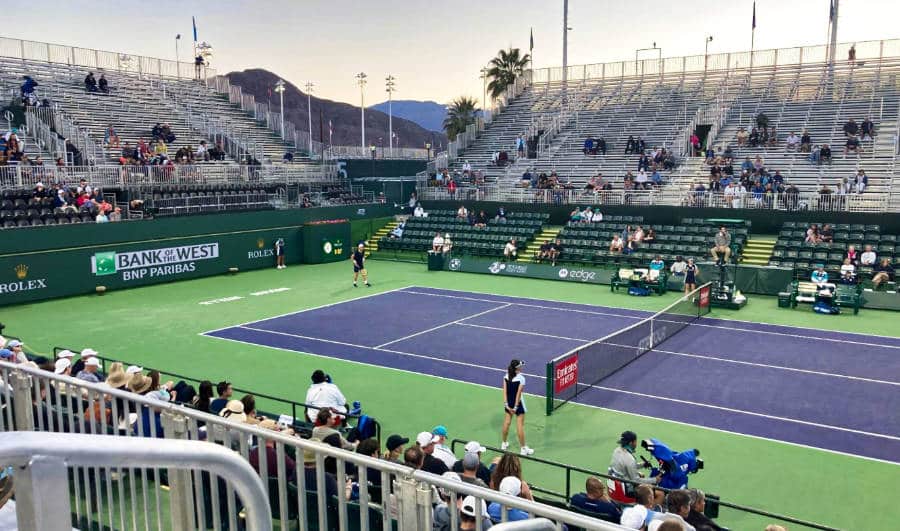 View of crowd watching tennis players competing in Paribas Open Tennis Tournament.