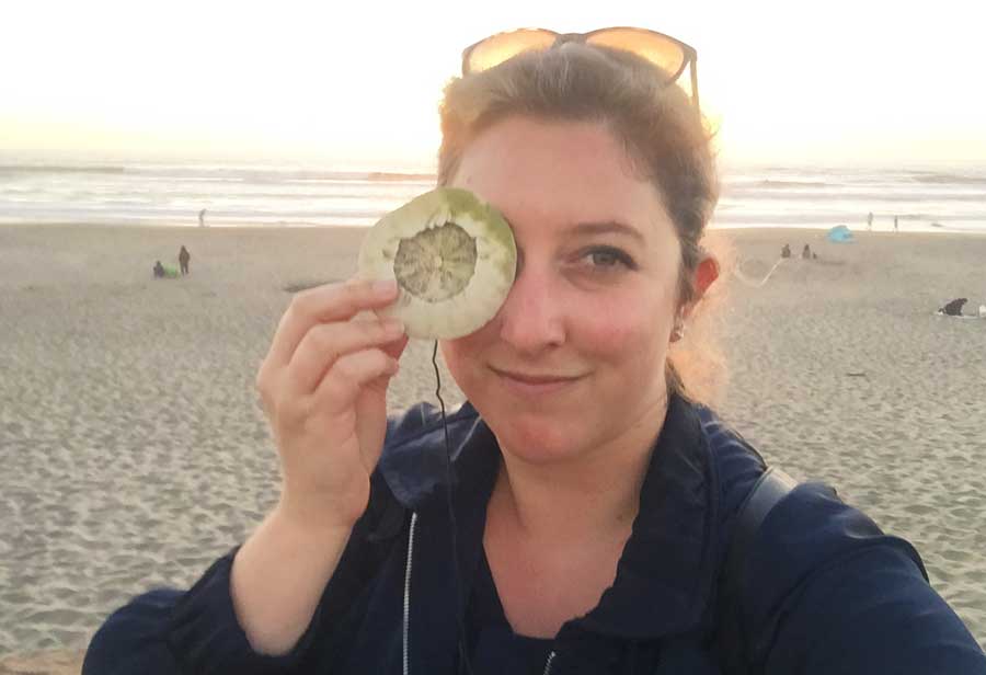 The author holding a shell while taking a selfie in Buccaneer Beach