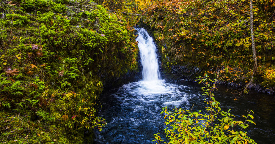 A charming small but picturesque view of Buck Creek Falls during the fall season