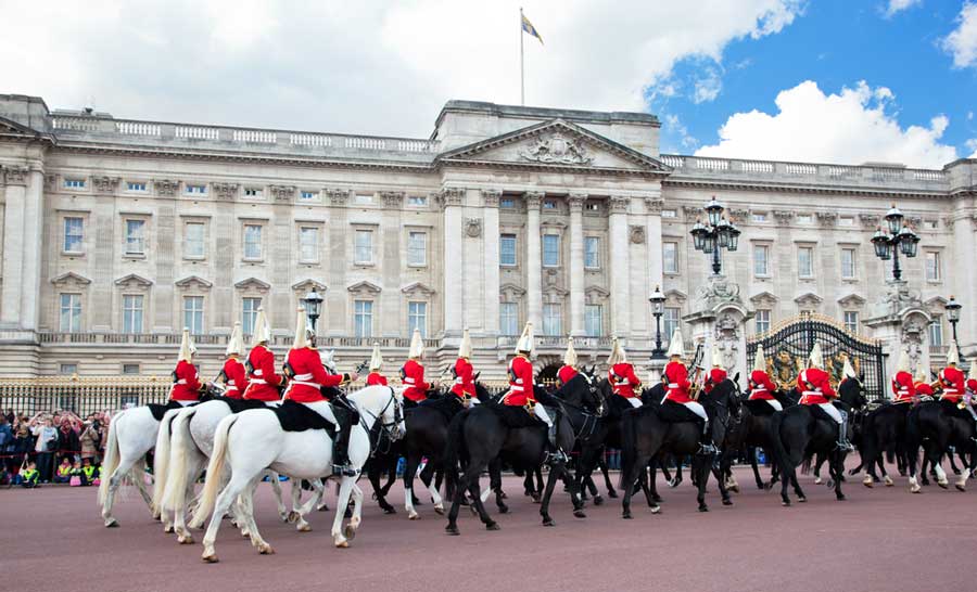 The royal guards riding their horses in Buckingham Palace