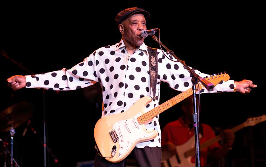 Buddy Guy performing with his guitar in Chicago