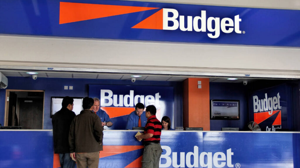 People inquiring at the Budget car rental office in Dublin Airport