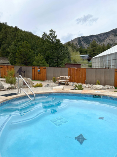 View of the pool with scenic mountain views behind