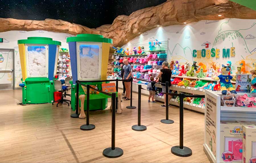 People with their kids wandering in T-REX merchandise shop
