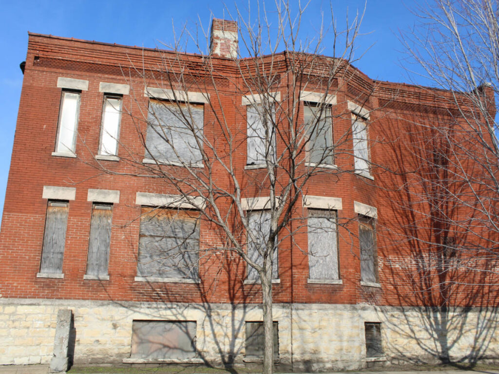 Clear blue sky over an abandoned building in Englewood neighborhood