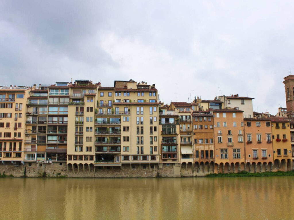 View of the budlings from across the Arno River on a gloomy day