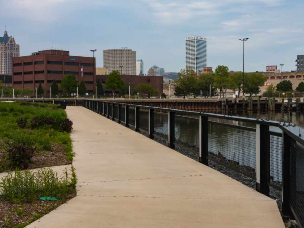 Skyline view of downtown Milwaukee featuring the Burnham Canal in Walker’s Point joins the Milwaukee River
