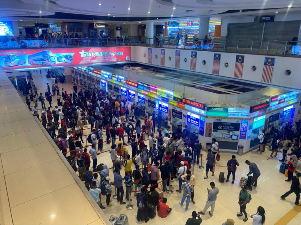 View of people falling in line at the main bus station in Kuala Lumpur