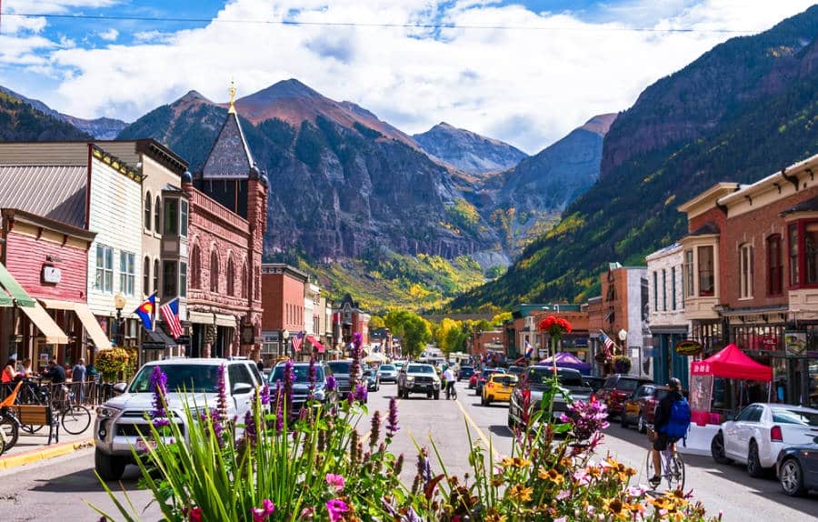 View of the flowers on the busy main street of Colorado Avenue, in downtown Telluride