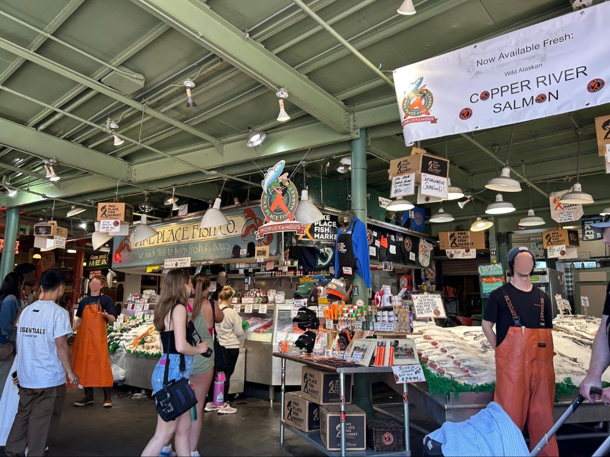 People buying seafood at Pike Place Fish Market