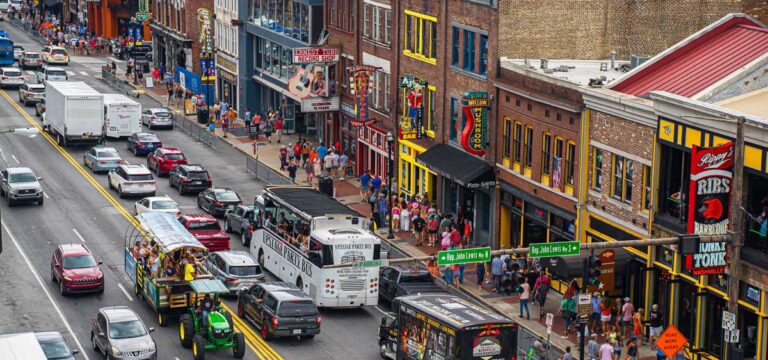 Many vehicles driving in a busy street in Nashville