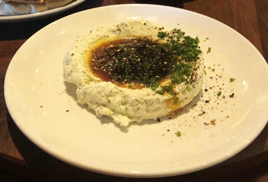 View of a whipped feta on a plate in Butcher & BEe