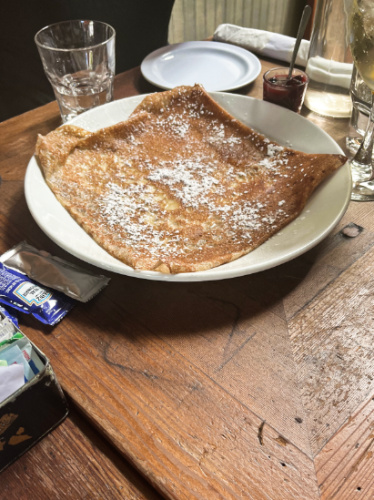 A plate with butter & sugar crepe