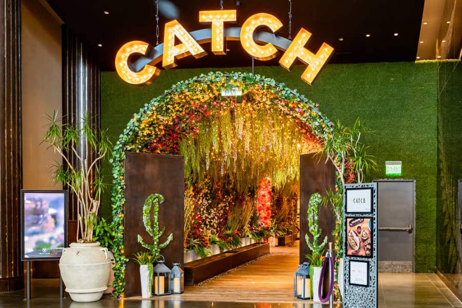 Eye catching and trendy botanical themed entrance of CATCH restaurant in Las Vegas.