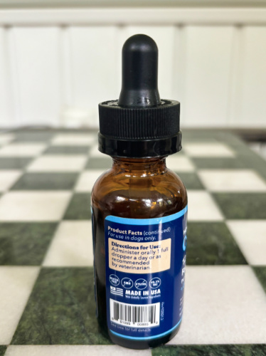 View of the instructions at the back of the bottle of CBD treats