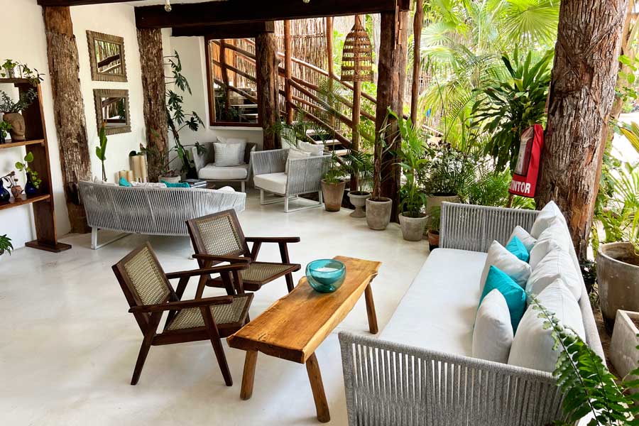 Chairs and tables on the lounge area of Cabañas Tulum Hotel