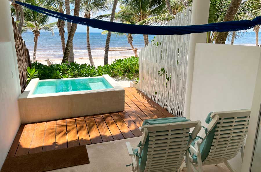 View of the pool overlooking the beach area from the Cabañas Tulum Hotel