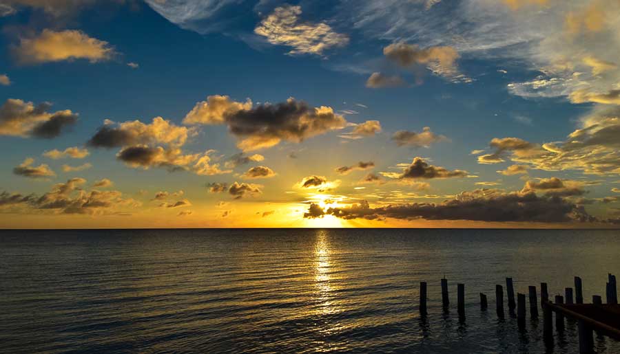 View of the ocean with a colorful sky during sunset