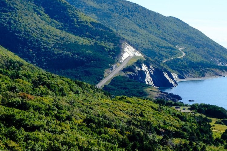 The Cabot Trail highway winds along steep cliffs overlooking the sea in Nova Scotia