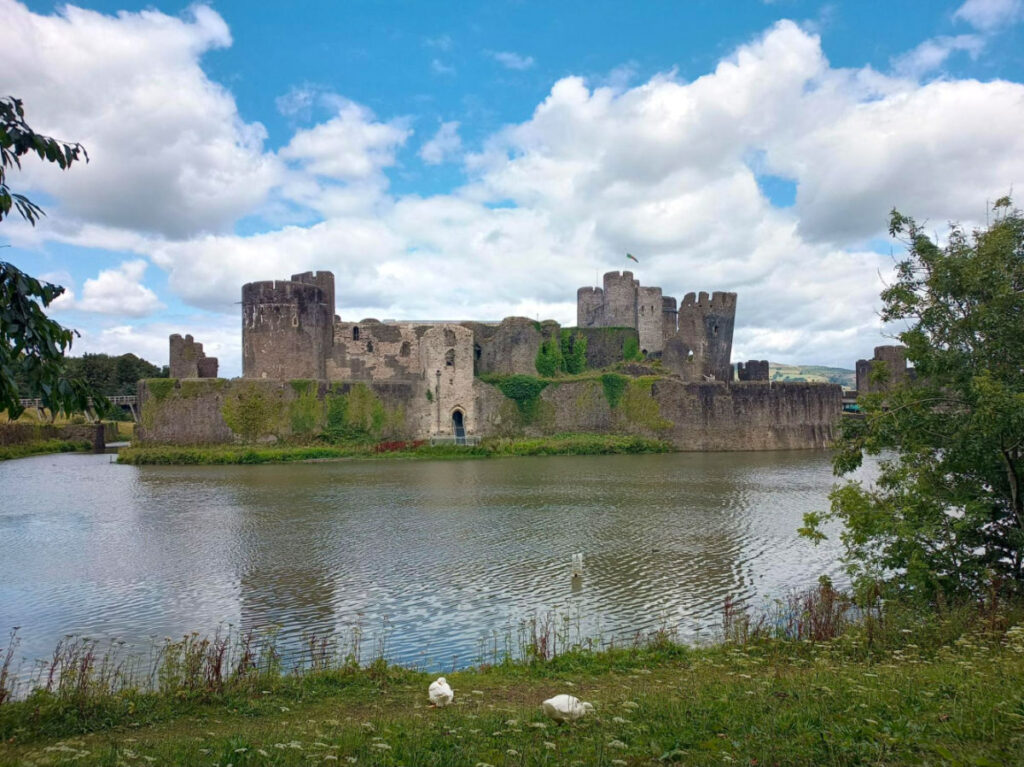 Exterior view of Caerphilly Castle surrounded by waters