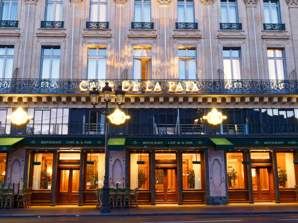 Night view of the facade of Café de la Paix