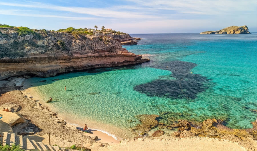 View of the clear water in Cala Comte Beach