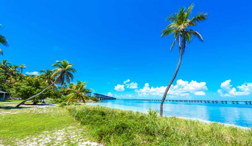 View of the blue water from Calusa Beach and the clear blue sky