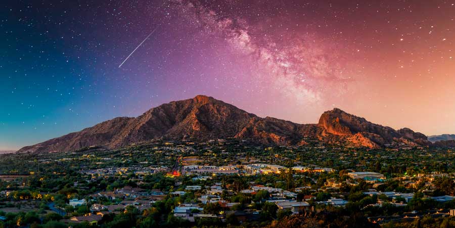 The milky way seen from the colorful night sky over the Camelback Mountain