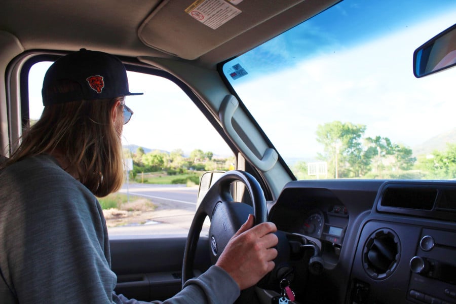 The author Abigail Nueve's husband driving the camper van rental in Paonia